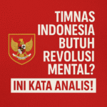 Poster dengan tulisan Timnas Indonesia Butuh Revolusi Mental dan lambang Garuda, latar merah